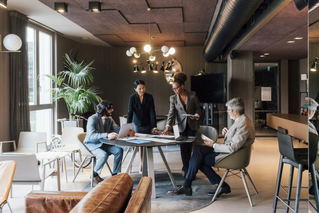 Professional team engaged in a meeting at a stylish office space.